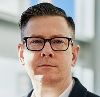 CEO Alexander Hughes, executiv al unei companii de trading crypto, portret